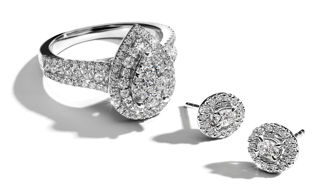 Diamond ring and earrings with halo set in white gold.